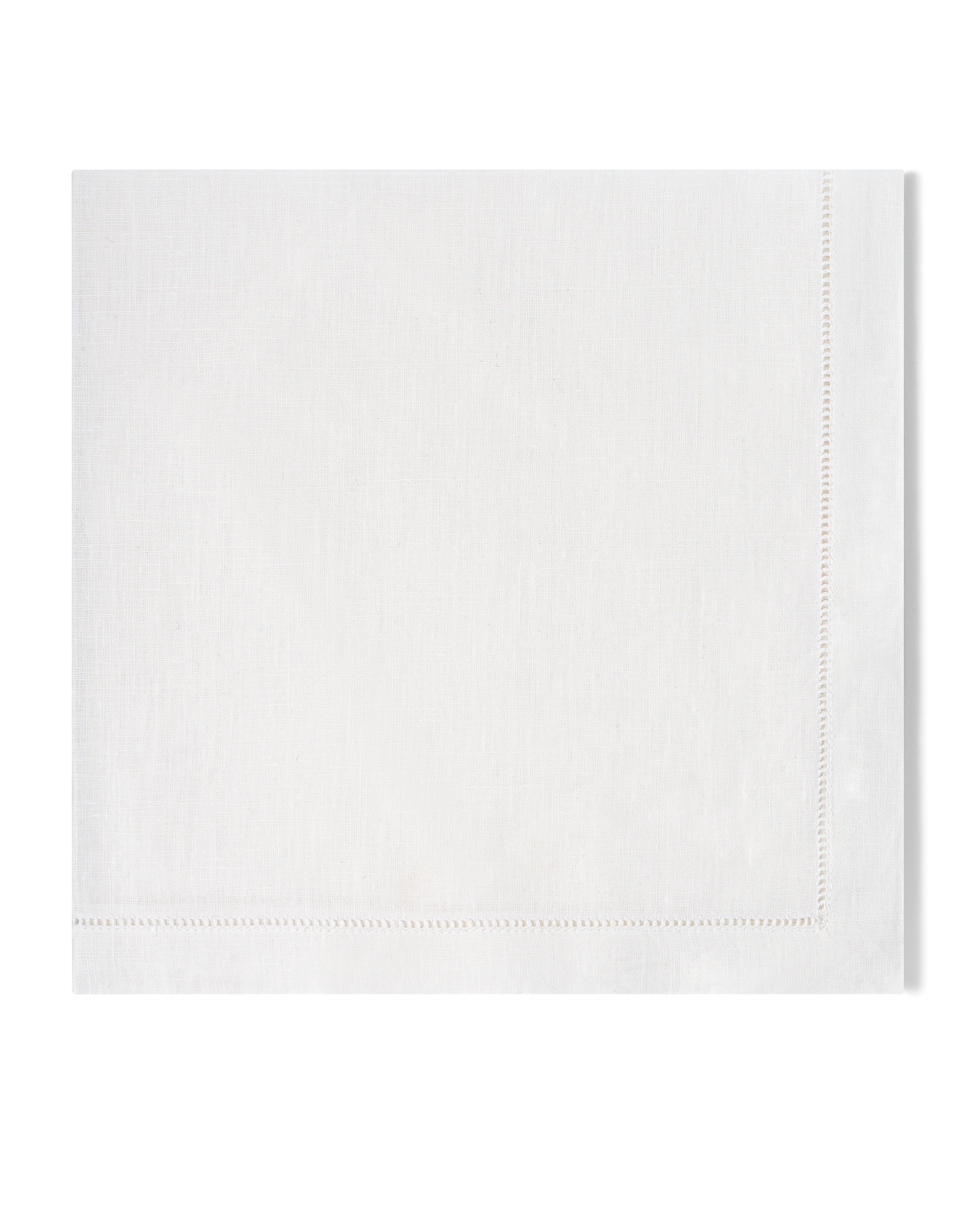 A white linen napkin with a hemstitch border