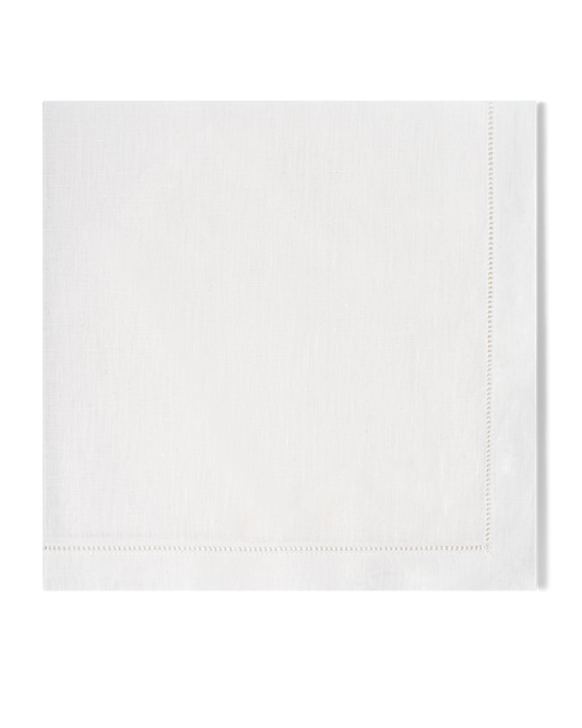 A white linen napkin with a hemstitch border