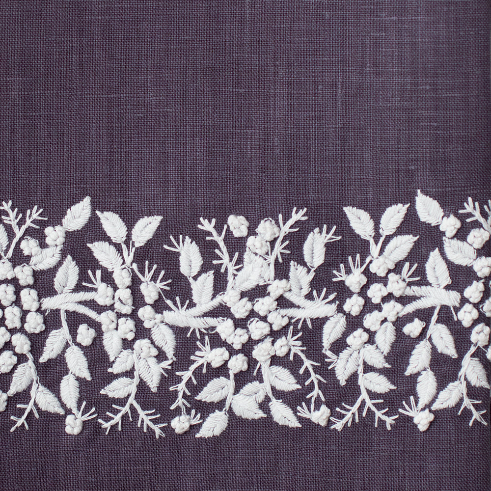 An example of charcoal linen with white embroidery