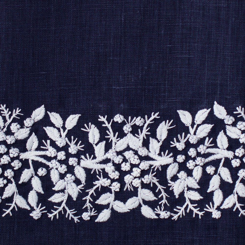 An example of navy linen with white embroidery