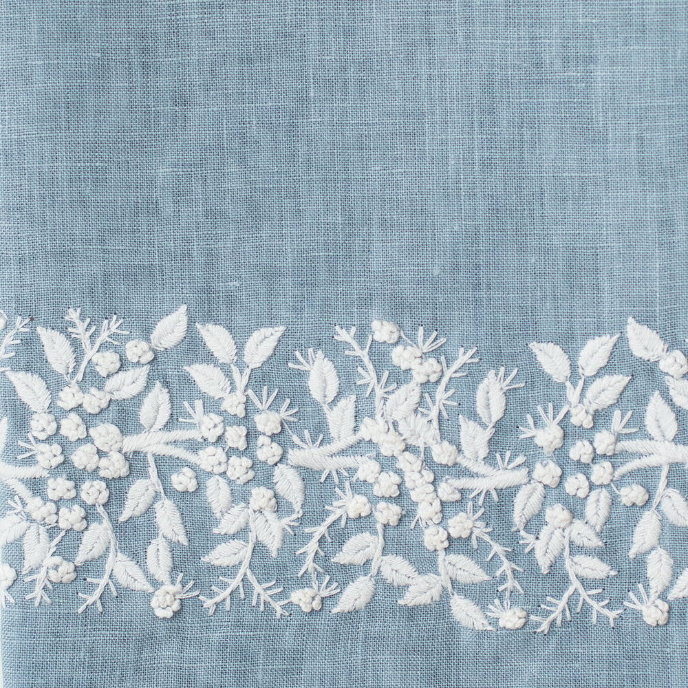 An example of sky blue linen with white embroidery