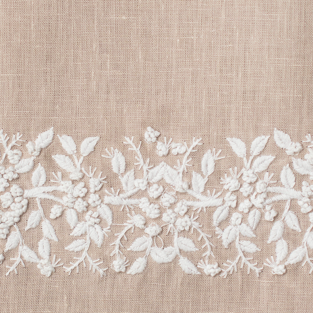 An example of taupe linen with white embroidery