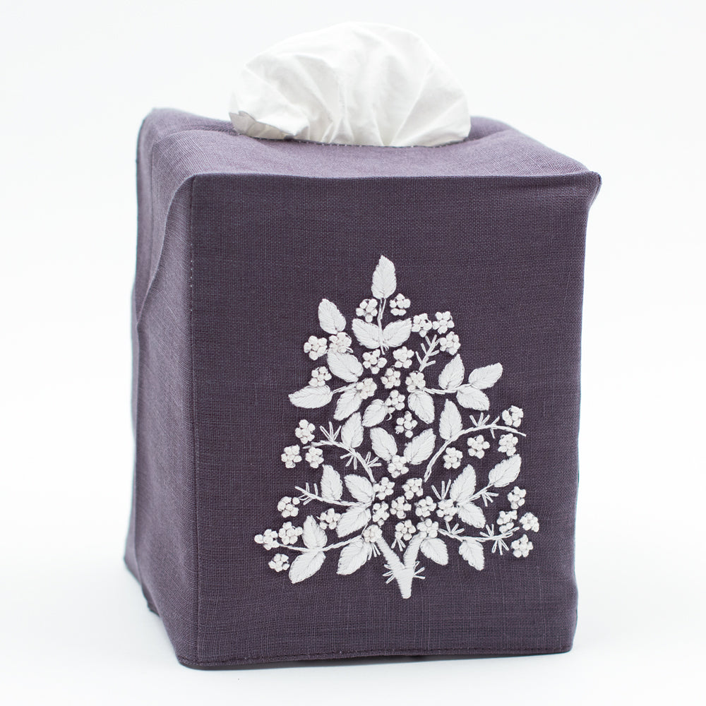 A charcoal linen square tissue box cover with white french knot floral embroidery