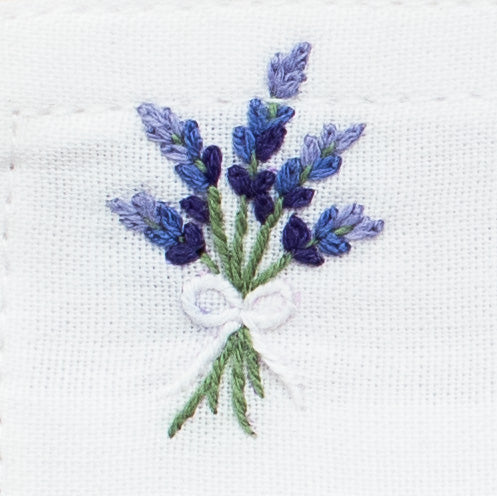 A detailed image of the embroidery - A bouquet of lavender tied with white string in a bow
