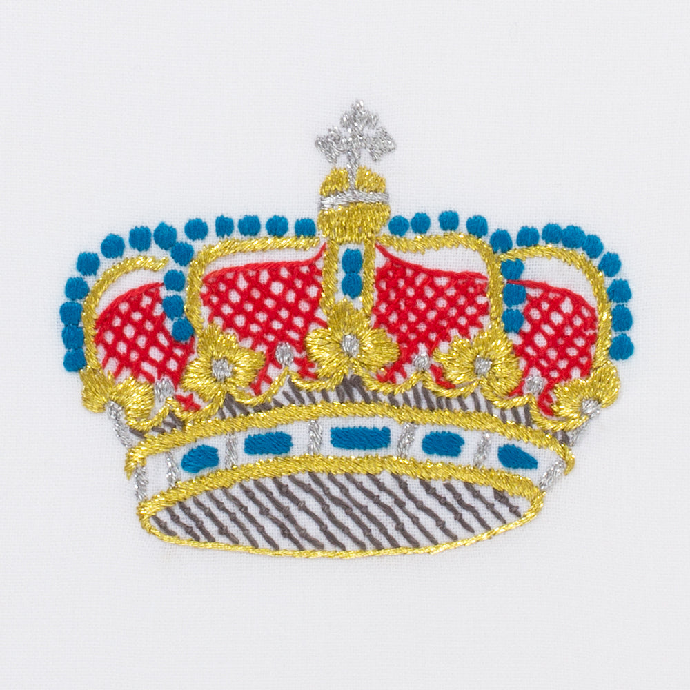 A detailed image of the embroidery -  A red, blue & gold crown with silver detailing