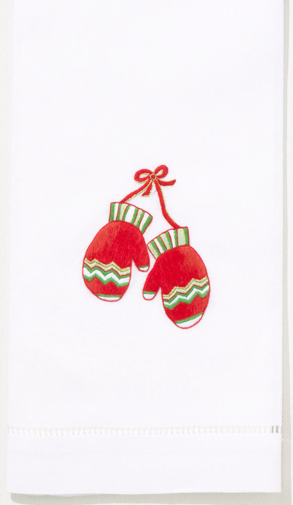 A white hand towel with a hemstitch. A pair of red mittens with green accents is embroidered in the center