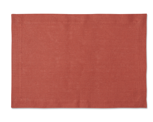 A linen placemat in the color brick