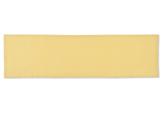 A linen table runner in the color butter