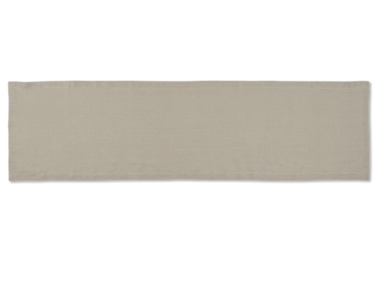 A linen table runner in the color sand
