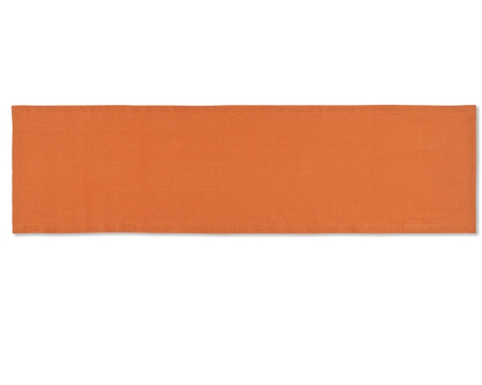 A linen table runner in the color tangerine