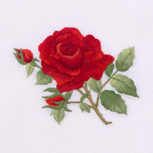 A detailed image of the embroidery - A red rose with green leaves
