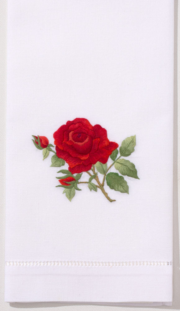A white hand towel with a hemstitch. A red rose is embroidered in the center