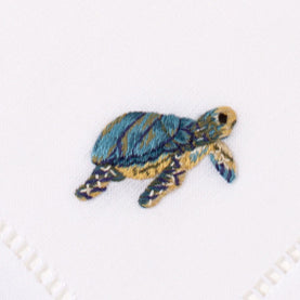 an embroidered blue and yellow sea turtle
