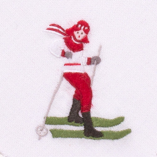 an embroidered female skier wearing red