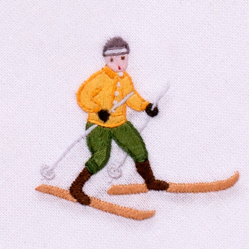 an embroidered male skier wearing yellow and green