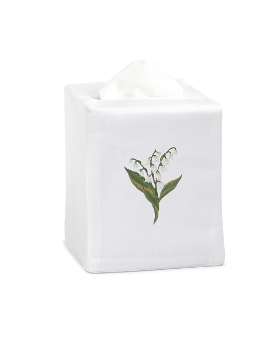 A white tissue cover with white lily of the valley flowers embroidered in the center.