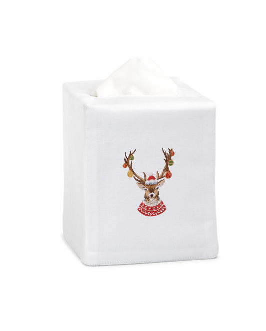 A white tissue cover with a stag with ornaments on his antlers embroidered in the center.