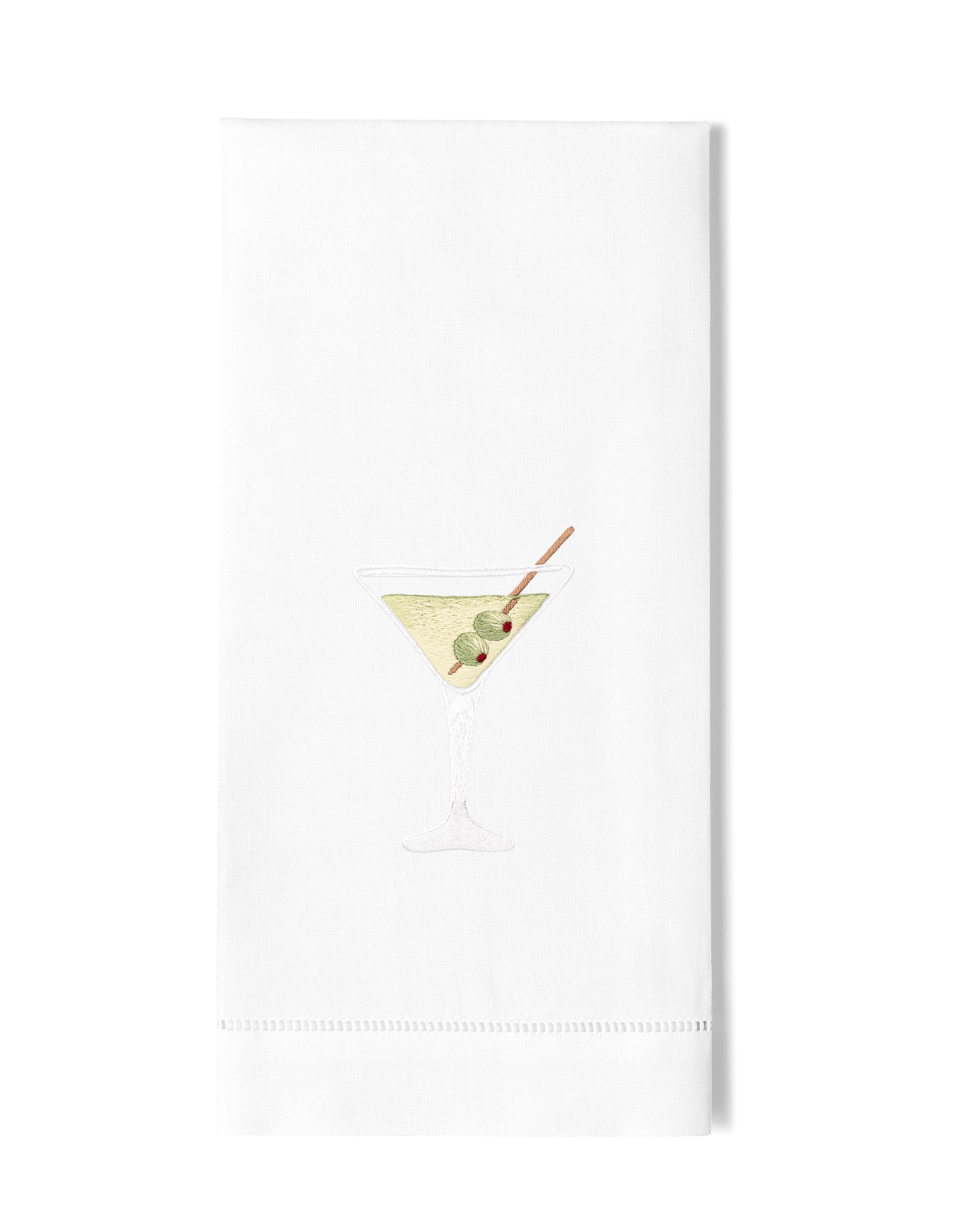 A white hand towel with a hemstitch. A dirty martini is embroidered in the center.