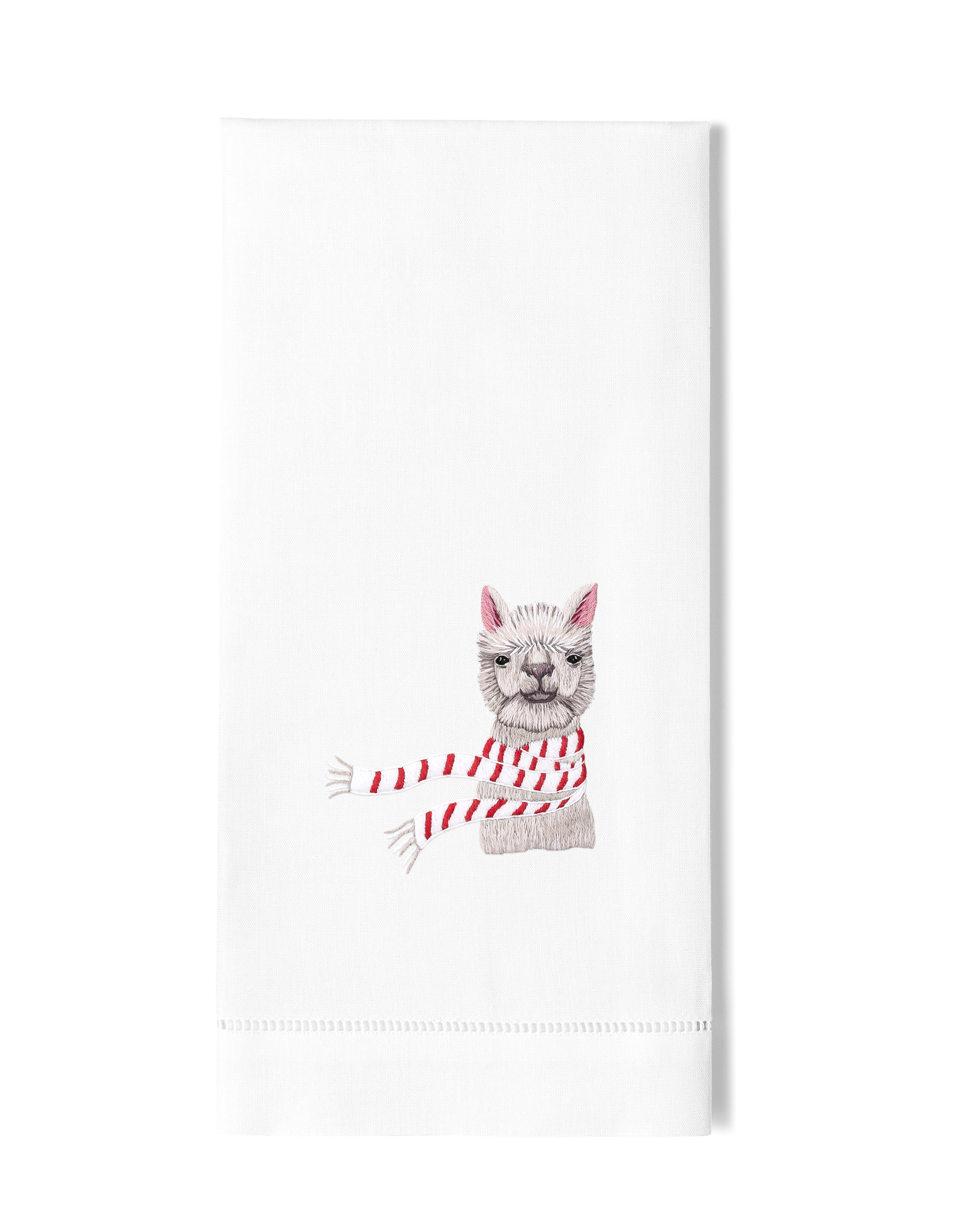 A white hand towel with a hemstitch. A white llama with a red and white scarf is embroidered in the center