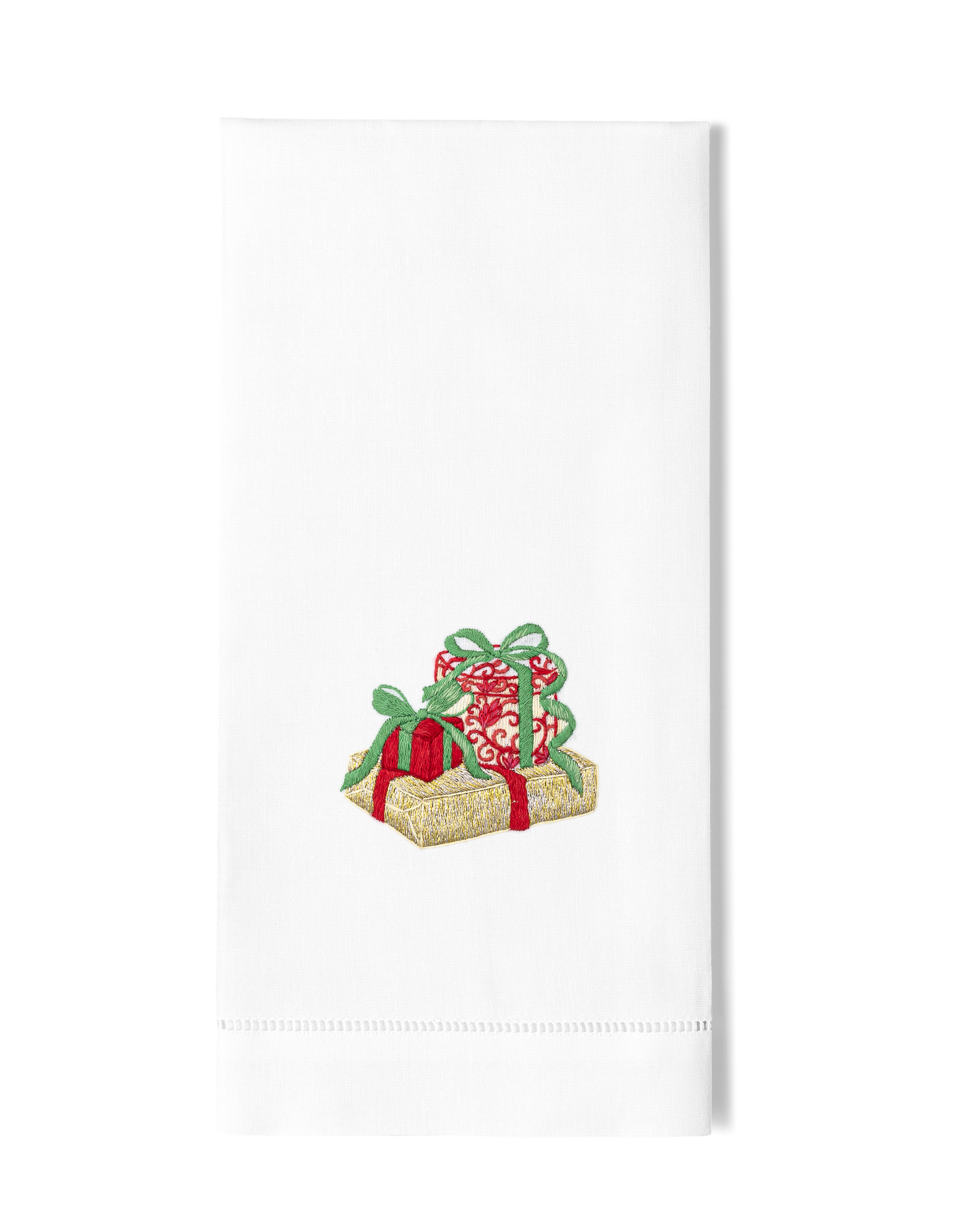 A white hand towel with a hemstitch. A trio of glittering christmas gifts are embroidered in the center