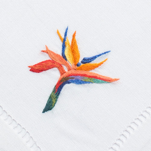 an embroidered multicolored bird of paradise flower