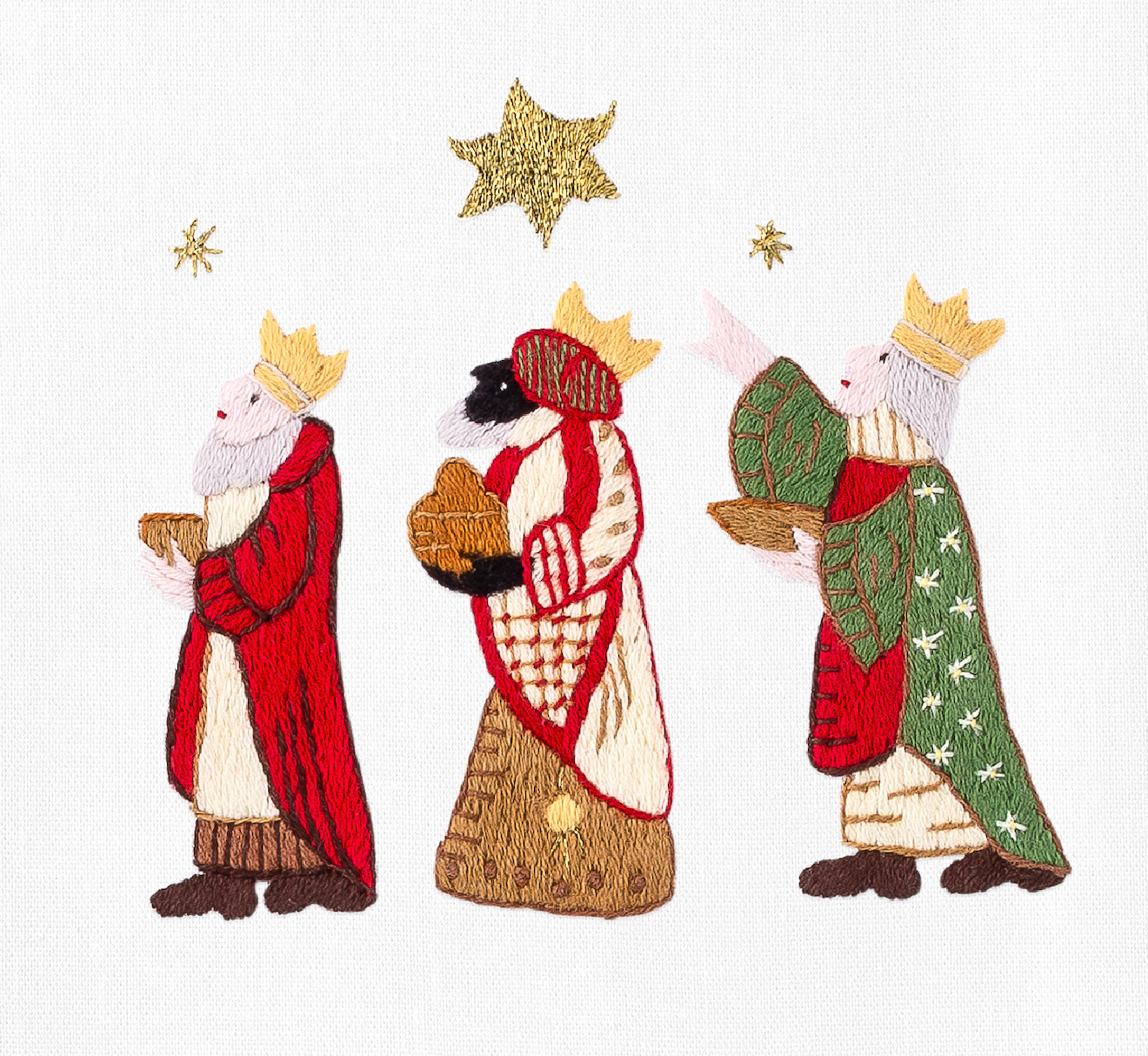 A detailed image of the embroidery - The 3 wise men carrying gifts & following a north star 